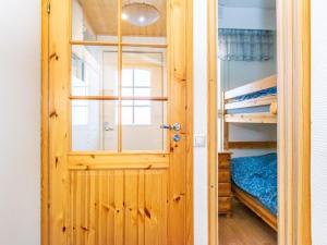 a door leading into a bedroom with a bunk bed at Holiday Home Outapailakka j 9 by Interhome in Saariselka +5 photos