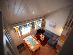 an overhead view of a living room with a table and a couch at Holiday Home Tunturikoivu a1 by Interhome in Saariselka