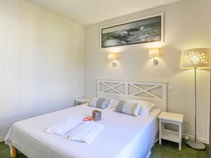 Ένα ή περισσότερα κρεβάτια σε δωμάτιο στο Apartment Le Château de Kergonano-7 by Interhome
