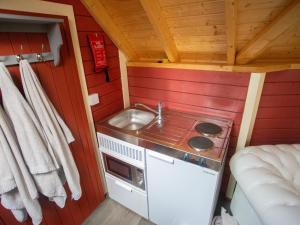 a small kitchen with a sink and a stove at Chalet Campbell by Interhome in Drumnadrochit