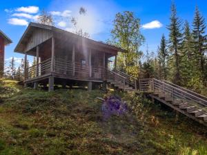a house on the side of a hill at Holiday Home Purontupa by Interhome in Sotkamo