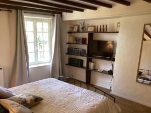 Postel nebo postele na pokoji v ubytování Phèdre en Saône