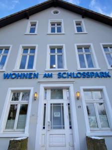 a white building with the sign for a woman and substance spam at New York Appartement in Bad Salzuflen