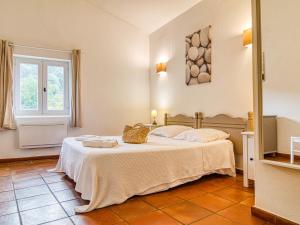 a bedroom with a bed and a window at Holiday Home Les Grenaches by Interhome in Draguignan
