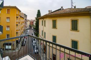 a view of a city street from a balcony at Borgo Maria Luigia, prot. PG 0209465 in Parma