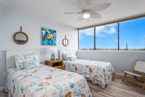 Postel nebo postele na pokoji v ubytování Our House At The Beach, East Tower, 5th Fl + 41 fotografií