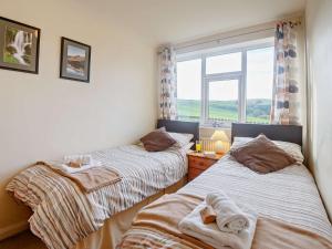 Giường trong phòng chung tại 2 Bed in Betws y coed 80629