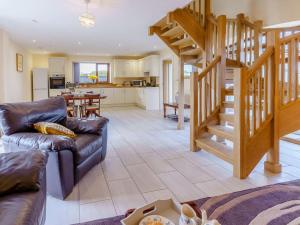 a living room with a couch and a staircase at 2 Bed in Lampeter 86507 in Cellan