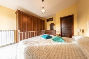 a bedroom with a bed with two pillows on it at La Casetta dei Gerani in Montemarano