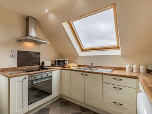 a kitchen with a sink and a window at 1 Bed in Hawarden 86711 in Hawarden