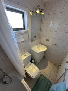 Un baño de Apart hotel Terra Valdivia
