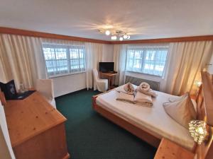 Postel nebo postele na pokoji v ubytování Hotel Möderle