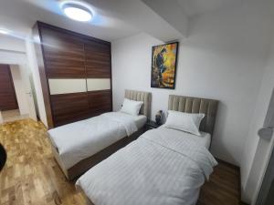 Ένα ή περισσότερα κρεβάτια σε δωμάτιο στο Luxury Vlae 1 Apartaments