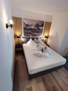 Postel nebo postele na pokoji v ubytování Hotel Möderle