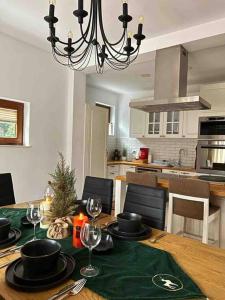 a dining room table with a christmas tree on it at Luxurious House for Rent in Pristina