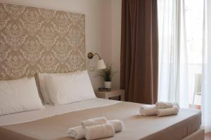 Krevet ili kreveti u jedinici u okviru objekta Zeta Resort Donnalucata