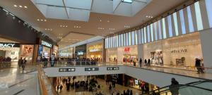 a large shopping mall with a lot of people in it at La Diletta - Camere di Charme in Verona