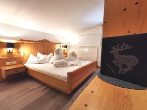 Postel nebo postele na pokoji v ubytování Hotel Möderle