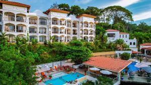 an aerial view of a hotel with a swimming pool at Shana by the Beach Manuel Antonio in Manuel Antonio