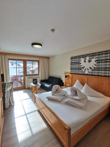 Postel nebo postele na pokoji v ubytování Hotel Möderle