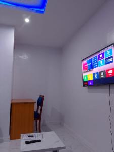 En TV eller et underholdningssystem på JKA 1-bed Luxury apartments