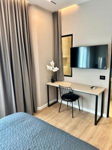 TV a/nebo společenská místnost v ubytování Venis Hotel