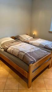 Postel nebo postele na pokoji v ubytování Ferienhaus Sprink Vulkaneifel