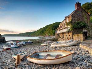 a group of boats sitting on a rocky beach at 3 bed property in Bude SHEPH in Merryfield