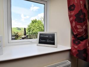 a window sill with a sign that reads welcome to steam relief at 1 Bed in Rhayader 45386 in Llangurig