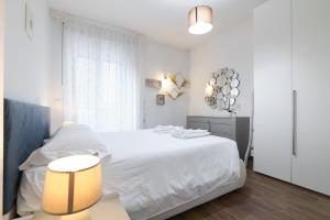 מיטה או מיטות בחדר ב-Mila Apartments Battista