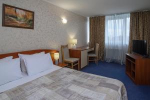 Postel nebo postele na pokoji v ubytování Cherkasy Palace