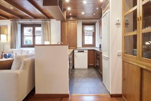 A kitchen or kitchenette at Val de Ruda Luxe 67 by FeelFree Rentals