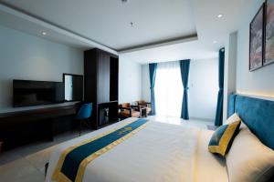 Postel nebo postele na pokoji v ubytování Gia An Hotel