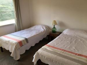 Postel nebo postele na pokoji v ubytování Casa de montaña, Las Chacritas