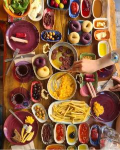 a table with many plates of food on it at Oksijen suit in Artvin