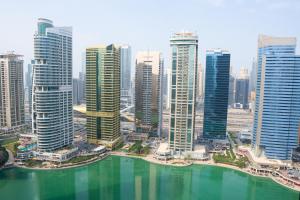 an aerial view of a city with tall buildings at Veluxa - Stylish 2 Bed with View in Dubai