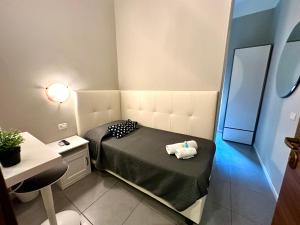 Postel nebo postele na pokoji v ubytování Golden Milano Hotel
