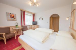 Letto o letti in una camera di Pension Bergblick