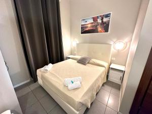 Postel nebo postele na pokoji v ubytování Golden Milano Hotel