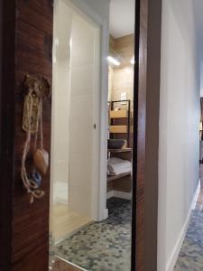 a hallway with a mirror and a closet at El Cielo de Cebreros in Cebreros +22 photos