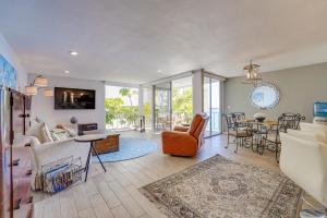 a living room with a couch and a table at Bayfront Paradise - Flexible 30 Day plus w Amazing Bay View and Pool in San Diego