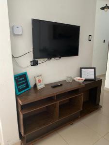 a flat screen tv hanging on a wall at Luxury Apartments Lima in Lima