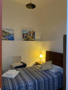 a bedroom with a bed with a blue comforter at Luxury Apartments Lima in Lima