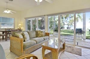 a living room with a couch and a table at Little Bay Compound in Islamorada
