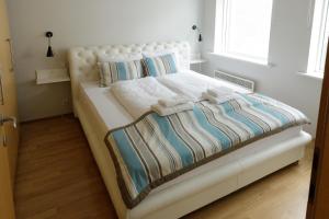 Uma cama ou camas num quarto em Hildibrand Apartment Hotel