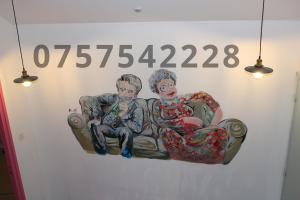 a painting of two people sitting on a couch at MMM soirée étape 