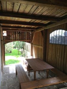 a wooden room with a wooden table in it at Chalupa Barbolica in Vernár