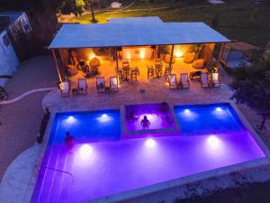 an overhead view of a swimming pool at night at Vista Mare Beach House in Tierra Bomba
