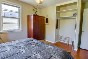 a bedroom with a bed and a dresser and a window at Cozy Memphis Vacation Rental Near Beale Street! in Memphis
