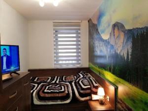 Ένα ή περισσότερα κρεβάτια σε δωμάτιο στο Apartman Janjic Jahorina